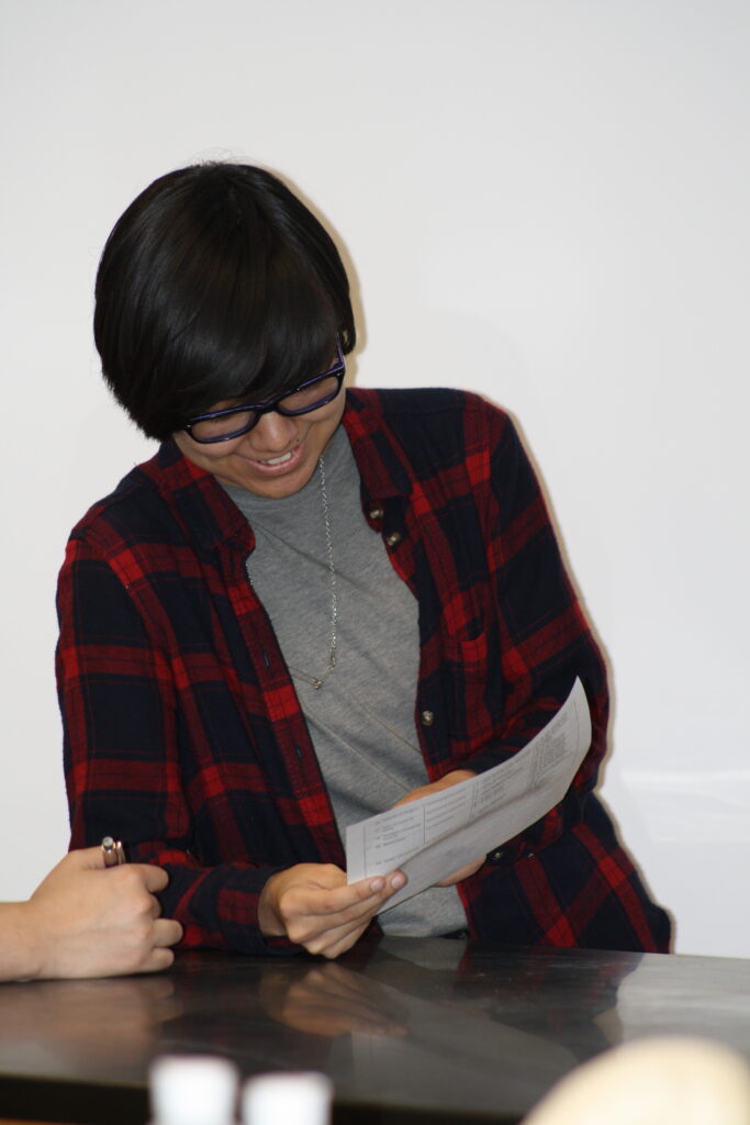 Indigenous students reading some notes in an common space on campus.